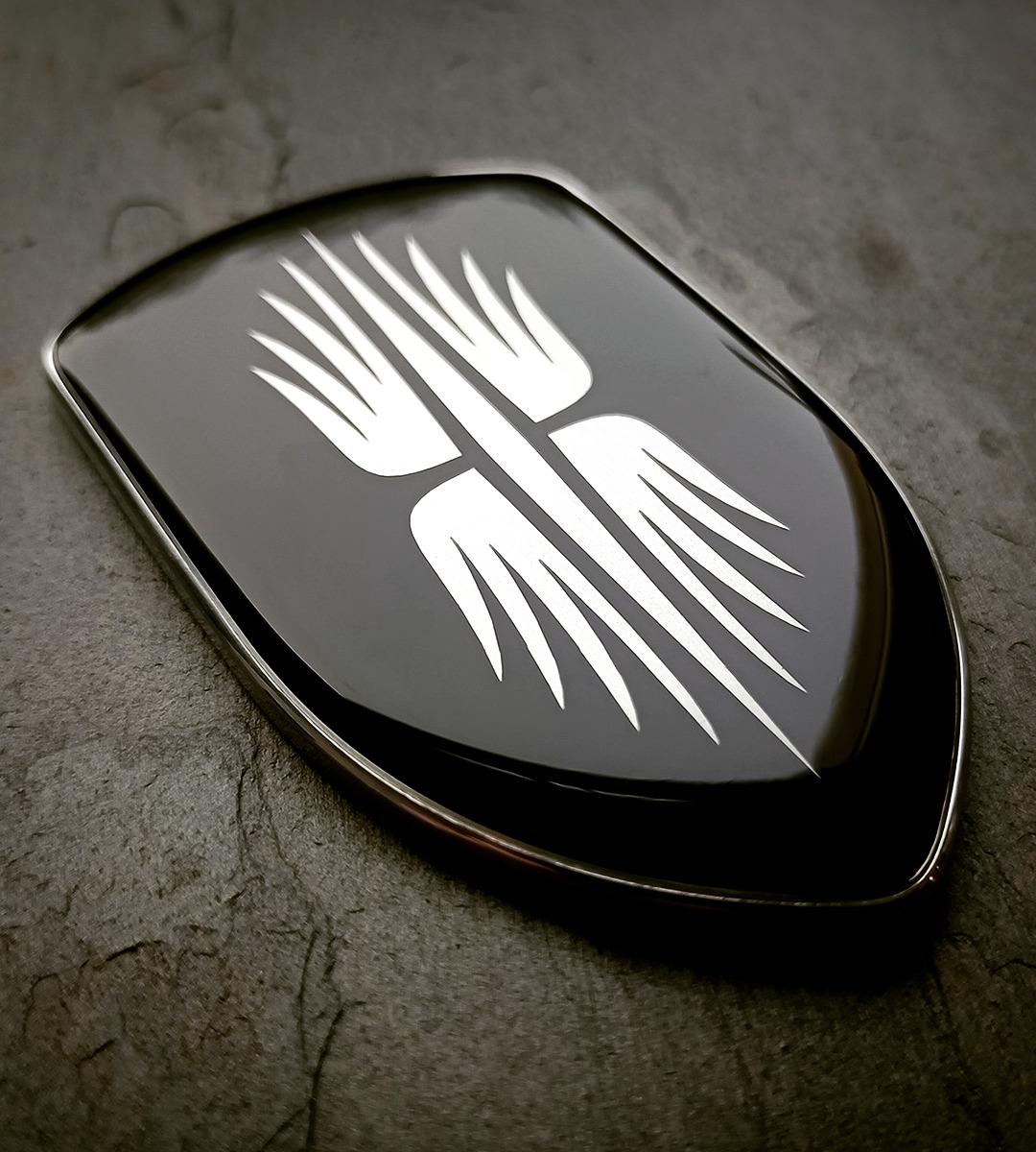 The hood badge finished with a dome of clear resin